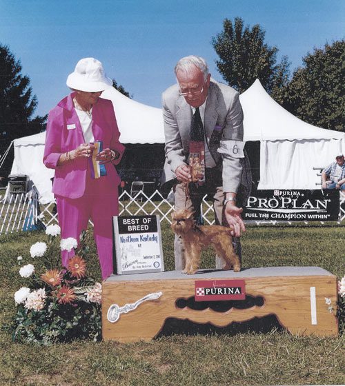 A man and woman standing next to each other.